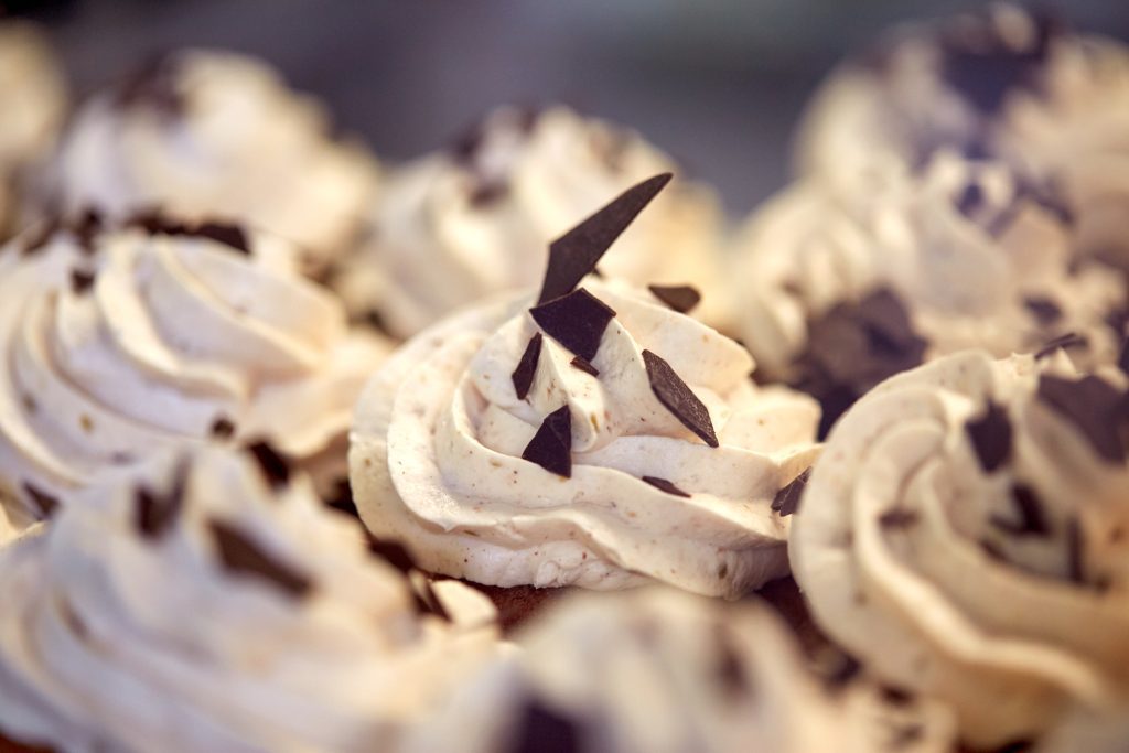 close up of cupcakes or muffins with frosting