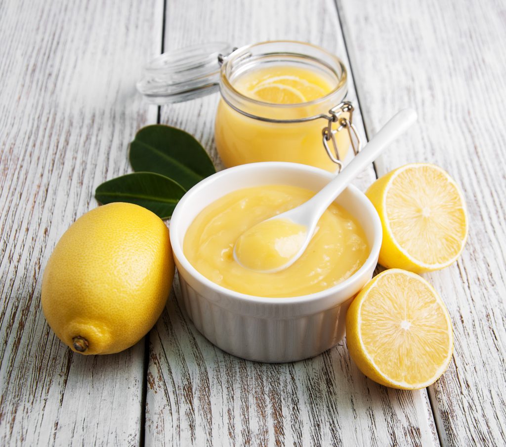 Lemon curd and fresh lemons